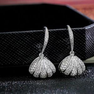 Silver shell shape earrings with pearl inside